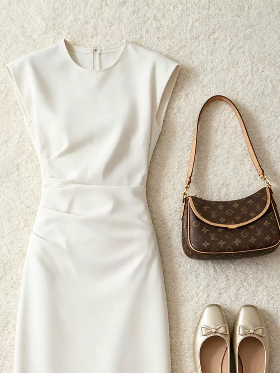 Simple elegant sleeveless off‑white dress