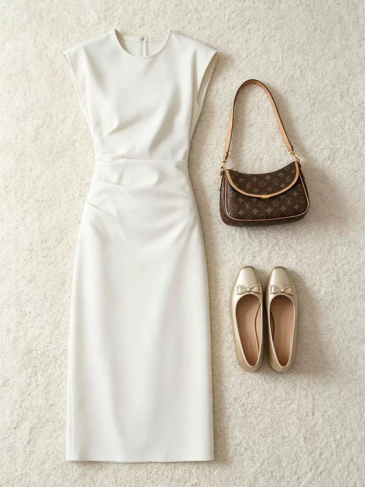 Simple elegant sleeveless off‑white dress