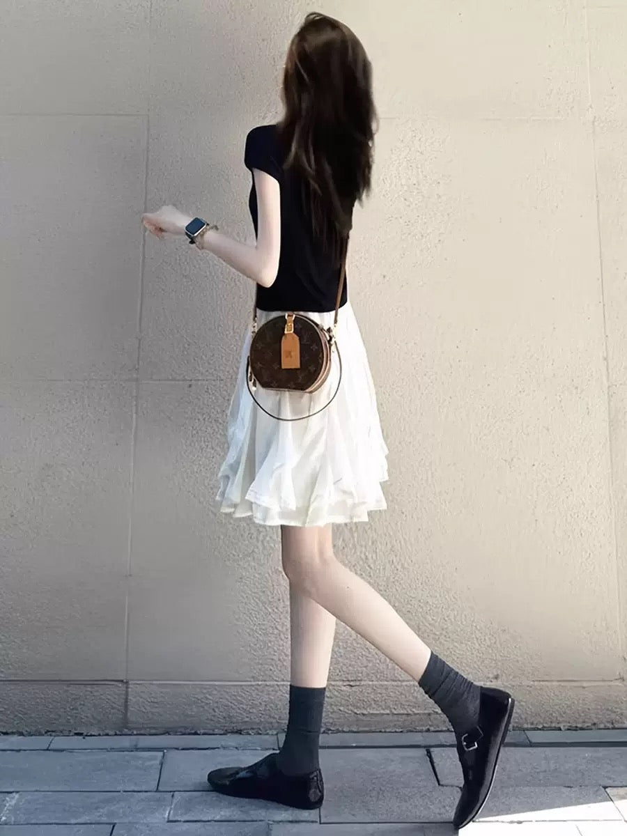 black mock neck top + irregular white tulle skirt